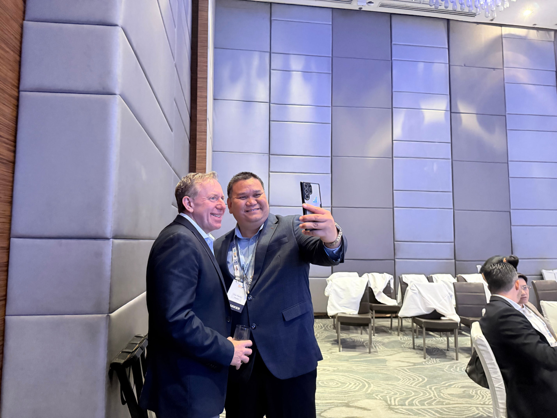 Jason Averbook posing for a photo with an attendee between sessions in Manila.
